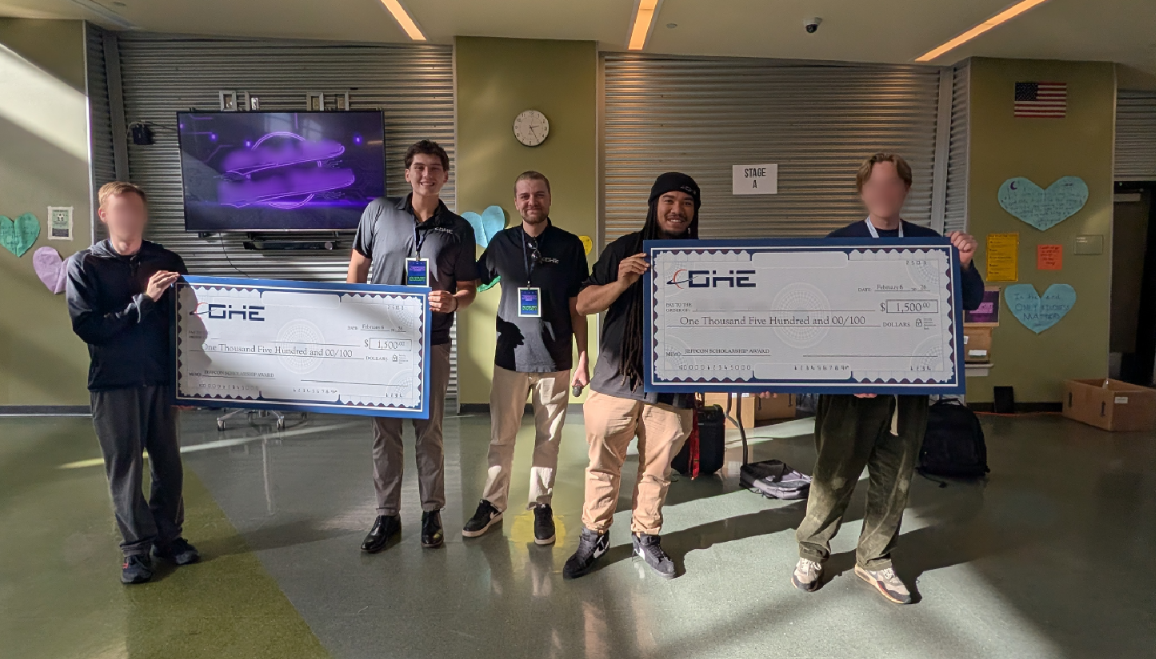 Students holding DHE $1,500 scholarship checks during the Jeffco Student Tech Conference 2026 at Bear Creek High School in Lakewood, Colorado.