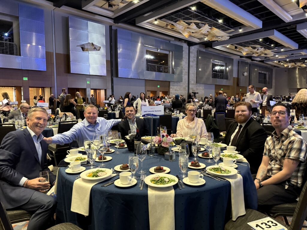 DHE Computer Systems team seated together at Table 21 at the Achieve Gala 2026 in Denver