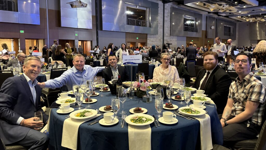 DHE Computer Systems team seated together at Table 21 at the Achieve Gala 2026 in Denver